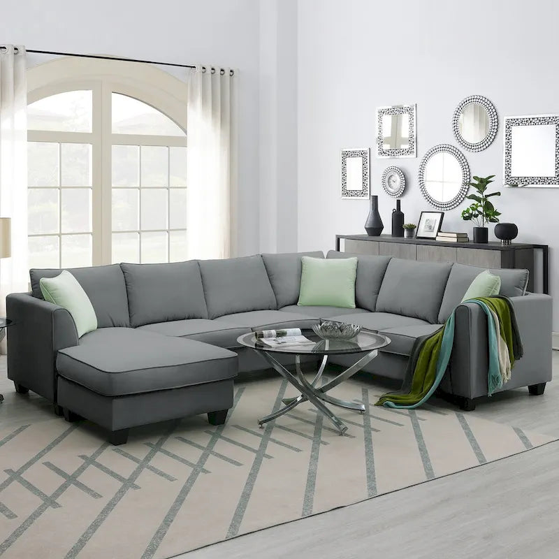 Canapé d'angle 7 places gris/noir avec pouf et 3 coussins